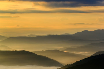 Layer of mountains in the mist at sunrise time, Sri Nan National Park, Nan Province, Thailand
