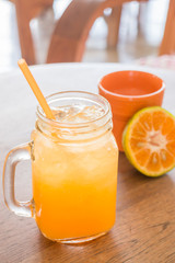 Fresh orange juice serving on wooden table