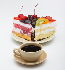 cup of coffee and delicious cake on white background