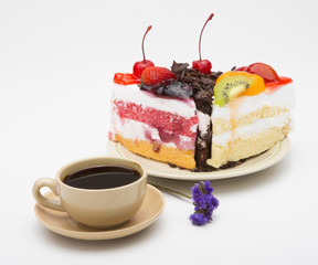 cup of coffee and delicious cake on white background