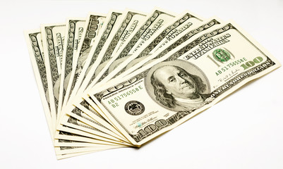 a lot of one hundred dollars isolated on white background
