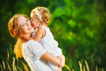 Happy family on summer. little girl child baby daughter hugging