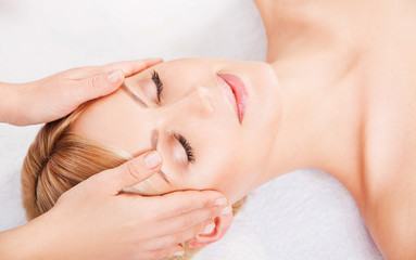 Young attractive woman getting spa treatment over white