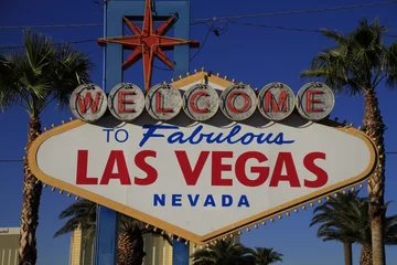Poster The Welcome to Fabulous Las Vegas sign on bright sunny day in Las Vegas.Welcome to Never Sleep city Las Vegas, Nevada Sign with the heart of Las Vegas scene in the background. © AmeriCantaro