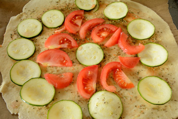 Raw pizza during preparation