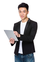 Young businessman use of the tablet pc