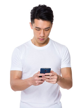 Asian young man use of the smartphone