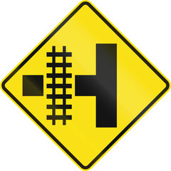 Obraz premium Warning road sign in Australia - Railroad crossing on the left