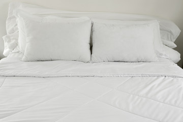Fototapeta na wymiar White pillows on a bed