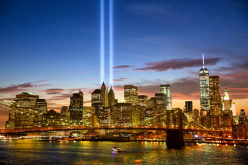 Manhattan skyline and the Towers of Lights (Tribute in Light) at sunset in New York