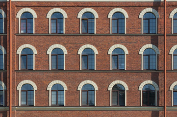 Fototapeta premium Many equal windows of the factory
