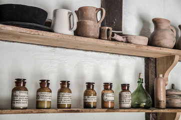 shelf of old glass bottles