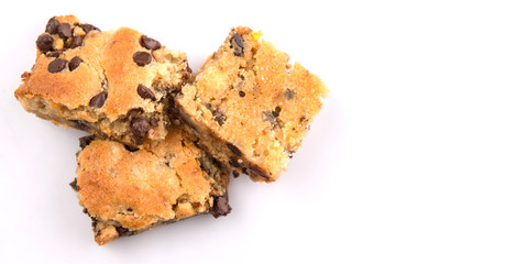 Sweet brownie dessert bar with chocolate chips over white background