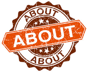 about orange round grunge stamp on white