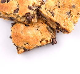 Sweet brownie dessert bar with chocolate chips over white background