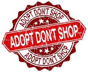 Obraz premium adopt don't shop red round grunge stamp on white