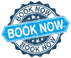 book now blue round grunge stamp on white