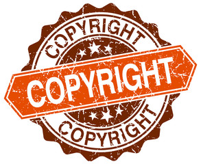 copyright orange round grunge stamp on white