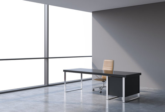 A workplace in a modern panoramic office, copy space view from the windows. A concept of financial consulting services. A brown leather chair and a black table. 3D rendering.