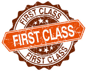 Obraz premium first class orange round grunge stamp on white