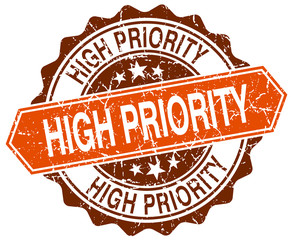 Obraz premium high priority orange round grunge stamp on white