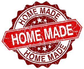 home made red round grunge stamp on white