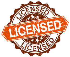 licensed orange round grunge stamp on white
