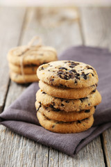 Chocolate chip cookies on grey wooden background