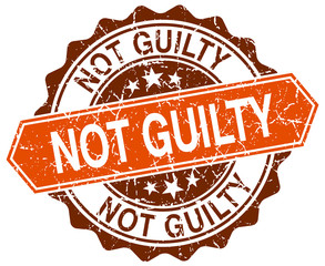 not guilty orange round grunge stamp on white