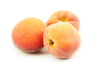 Fresh peaches fruit isolated on a white