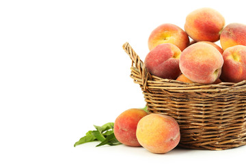 Fresh peach fruit in basket on a white background