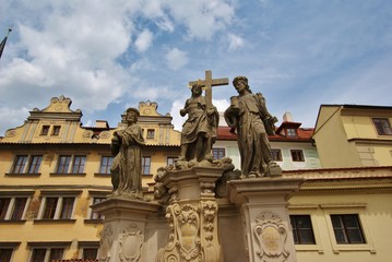 Fototapeta na wymiar Спаситель святые Косьма и Дамиан скульптура на Карловом мосту в Праге