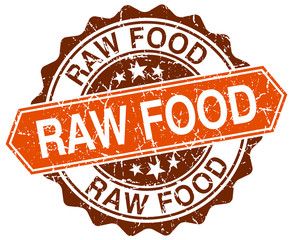 raw food orange round grunge stamp on white