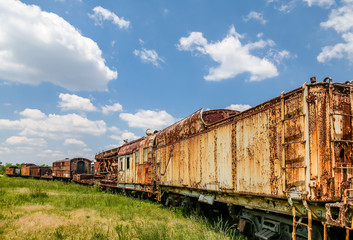 Fototapeta na wymiar Rusty Train Under Nice Skies