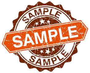 sample orange round grunge stamp on white
