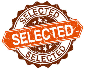 selected orange round grunge stamp on white