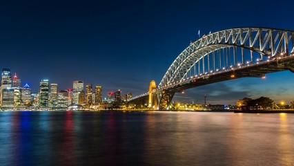 Fototapeta na wymiar Sydney's opera house and skyline seen from the harbour bridge