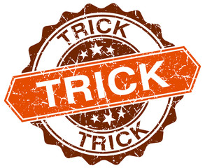 trick orange round grunge stamp on white