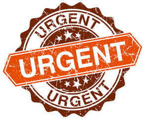 urgent orange round grunge stamp on white