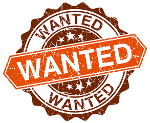 wanted orange round grunge stamp on white