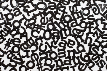 Cutout letters mixed in abstract design