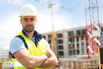 Portrait of an attractive worker on a construction site