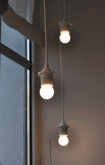 A small lamps and a window in the evening