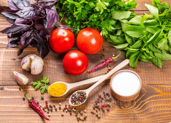 vegetables, basil and spices on the wood table