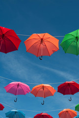 Obraz premium Streets are decorated with colorful umbrellas. 