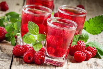 Red refreshing cocktail with raspberry and mint, selective focus