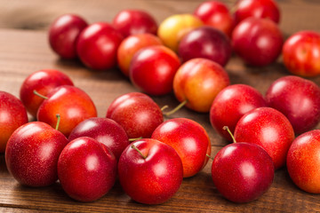 Sweet plums on wooden background