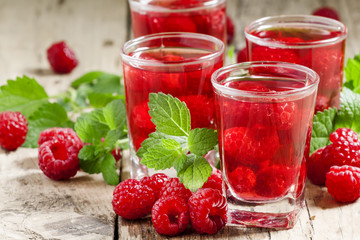 Red refreshing cocktail with raspberry and mint, selective focus