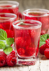 Red refreshing cocktail with raspberry and mint, selective focus