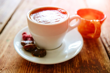 Cup of coffee on a wooden background